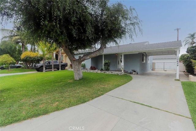 10624 Shellyfield Rd, Downey, CA 90241 - view of front of property featuring a front yard, concrete driveway, an attached carport, and stucco siding