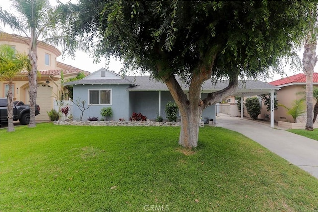 10624 Shellyfield Rd, Downey, CA 90241 - view of front of house featuring stucco siding, a front lawn, concrete driveway, and an attached carport