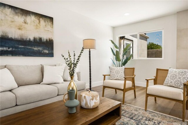 9802 Effingham Dr, Huntington Beach, CA 92646 - living room with wood finished floors, baseboards, and recessed lighting