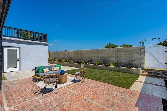 9802 Effingham Dr, Huntington Beach, CA 92646 - fenced backyard featuring a gate, outdoor lounge area, a patio, and a balcony