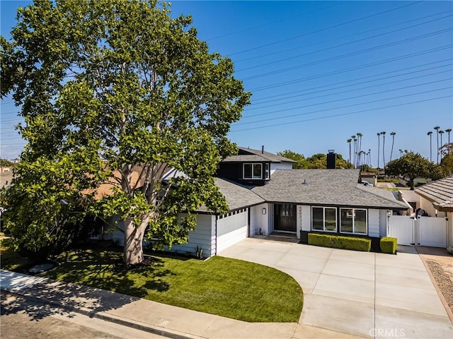 9802 Effingham Dr, Huntington Beach, CA 92646 - view of front of house with a garage, a gate, concrete driveway, and a shingled roof