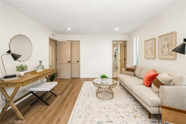 9802 Effingham Dr, Huntington Beach, CA 92646 - living room featuring recessed lighting, light wood-style floors, and baseboards