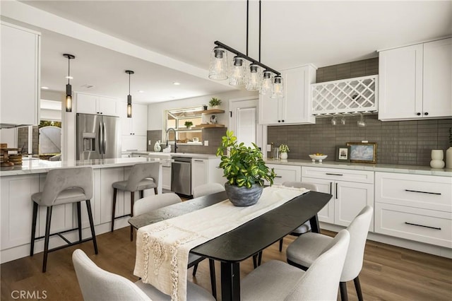 9802 Effingham Dr, Huntington Beach, CA 92646 - dining space featuring dark wood-style floors and recessed lighting