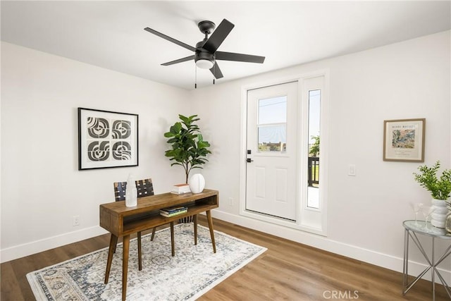 9802 Effingham Dr, Huntington Beach, CA 92646 - home office featuring baseboards, wood finished floors, and a ceiling fan