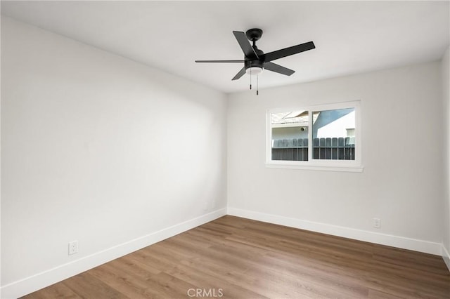 9802 Effingham Dr, Huntington Beach, CA 92646 - spare room featuring baseboards, wood finished floors, and a ceiling fan