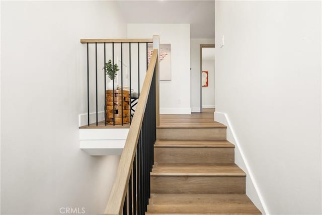 9802 Effingham Dr, Huntington Beach, CA 92646 - stairs with wood finished floors and baseboards