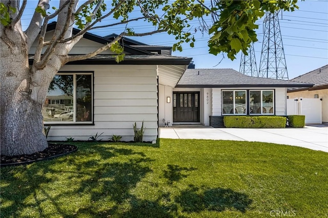 9802 Effingham Dr, Huntington Beach, CA 92646 - view of front facade featuring roof with shingles