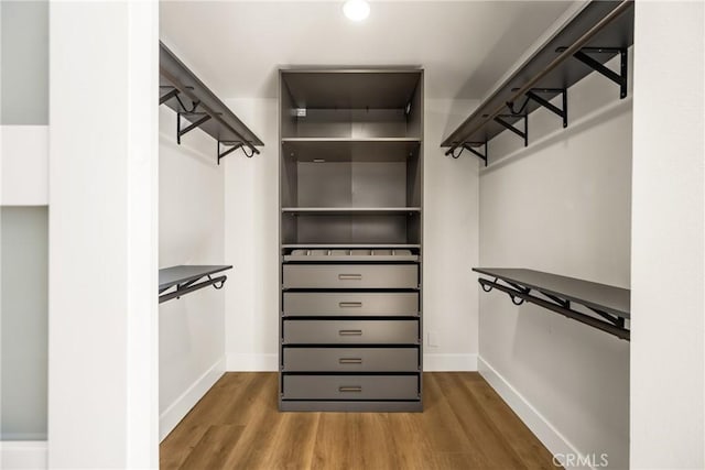 9802 Effingham Dr, Huntington Beach, CA 92646 - walk in closet featuring wood finished floors