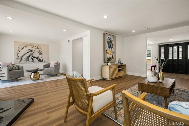 9802 Effingham Dr, Huntington Beach, CA 92646 - living area featuring recessed lighting, wood finished floors, and baseboards