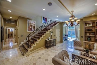 19162 Liggett St, Northridge, CA 91324 - stairs featuring a chandelier, recessed lighting, and baseboards