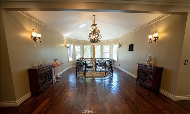 19162 Liggett St, Northridge, CA 91324 - dining area featuring a chandelier, dark wood-type flooring, crown molding, and baseboards