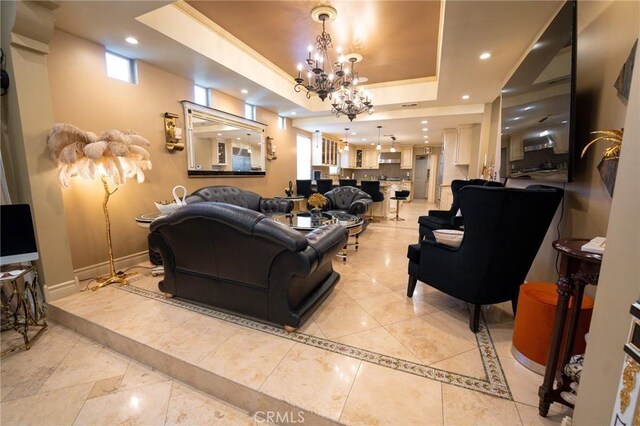 19162 Liggett St, Northridge, CA 91324 - living area with a tray ceiling, a chandelier, recessed lighting, baseboards, and inlaid floor details