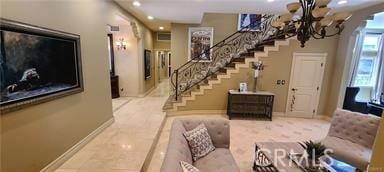 19162 Liggett St, Northridge, CA 91324 - foyer with a chandelier, baseboards, recessed lighting, and stairs