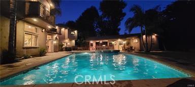 19162 Liggett St, Northridge, CA 91324 - pool at twilight with an outdoor pool