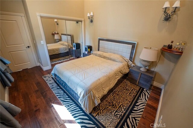 19162 Liggett St, Northridge, CA 91324 - bedroom with hardwood / wood-style floors, a closet, and baseboards