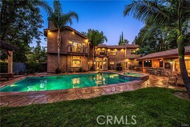 19162 Liggett St, Northridge, CA 91324 - view of pool with a patio, a pool with connected hot tub, and a yard