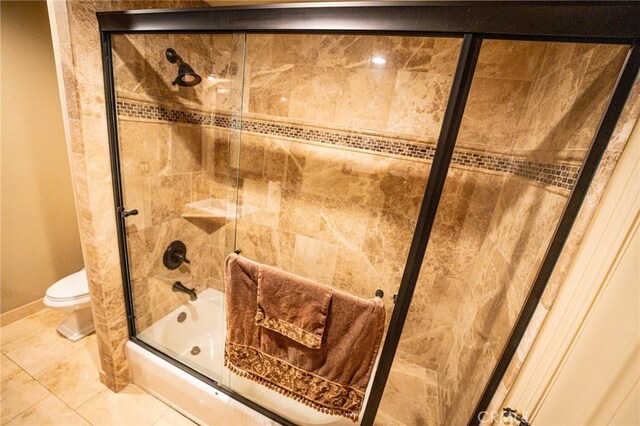 19162 Liggett St, Northridge, CA 91324 - bathroom featuring toilet, combined bath / shower with glass door, tile patterned floors, and baseboards