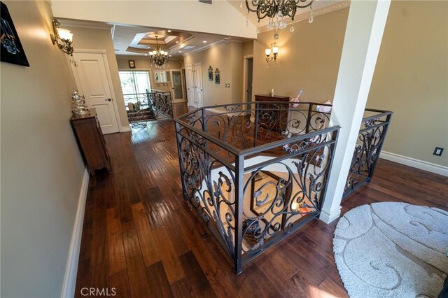 19162 Liggett St, Northridge, CA 91324 - corridor with a chandelier, crown molding, an upstairs landing, wood-type flooring, and baseboards