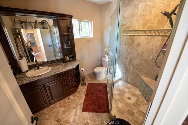 19162 Liggett St, Northridge, CA 91324 - bathroom with a stall shower, vanity, and toilet