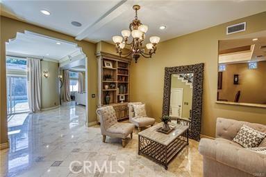 19162 Liggett St, Northridge, CA 91324 - sitting room featuring a chandelier, light marble finish flooring, and recessed lighting
