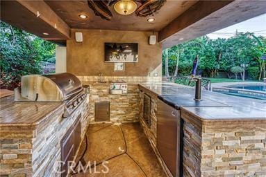 19162 Liggett St, Northridge, CA 91324 - view of patio featuring exterior kitchen