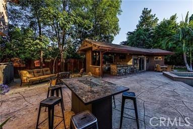 19162 Liggett St, Northridge, CA 91324 - view of patio / terrace with outdoor lounge area and a jacuzzi