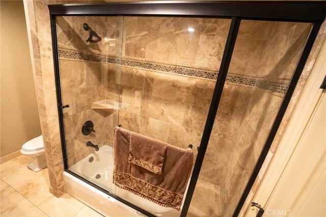 19162 Liggett St, Northridge, CA 91324 - bathroom with toilet, bath / shower combo with glass door, tile patterned floors, and baseboards