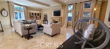 19162 Liggett St, Northridge, CA 91324 - living area featuring a fireplace, beamed ceiling, recessed lighting, tile patterned floors, and baseboards