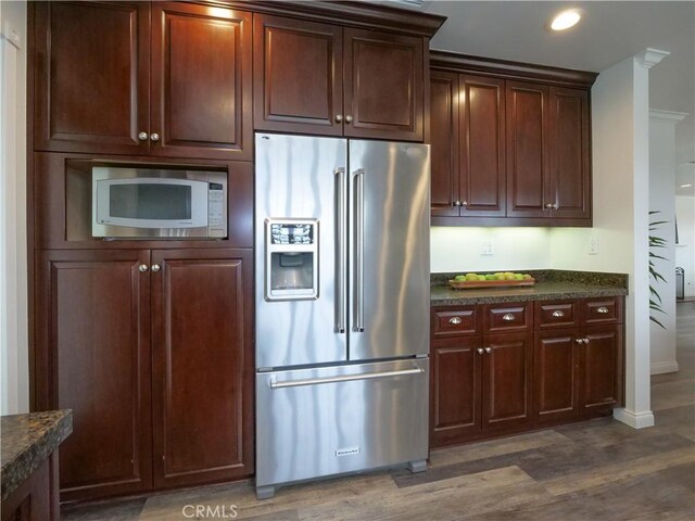2048 264th St, Lomita, CA 90717 - kitchen featuring high end fridge, white microwave, dark wood-style flooring, baseboards, and dark stone counters