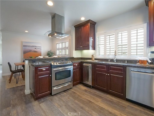 2048 264th St, Lomita, CA 90717 - kitchen with appliances with stainless steel finishes, island range hood, a sink, dark wood finished floors, and recessed lighting