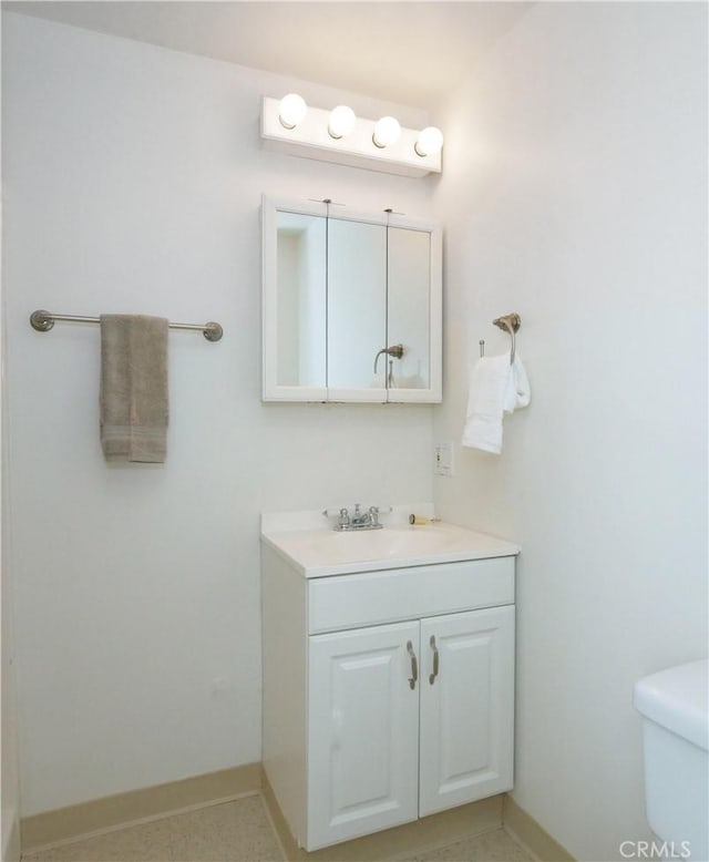 2048 264th St, Lomita, CA 90717 - bathroom featuring toilet, vanity, and baseboards