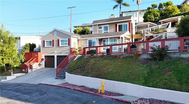 2048 264th St, Lomita, CA 90717 - view of front of property featuring concrete driveway, stairway, and an attached garage