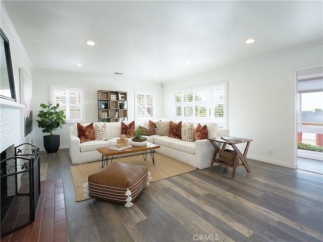 2048 264th St, Lomita, CA 90717 - living area featuring dark wood-type flooring, crown molding, recessed lighting, a brick fireplace, and baseboards