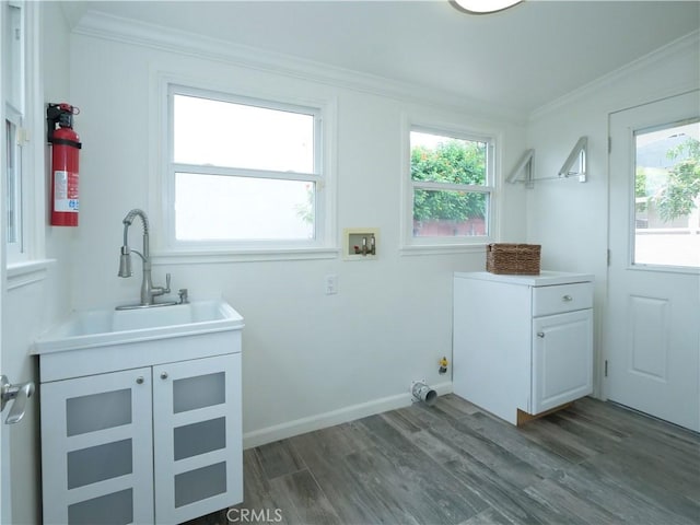2048 264th St, Lomita, CA 90717 - laundry area with hookup for a washing machine, cabinet space, crown molding, dark wood-style floors, and healthy amount of natural light