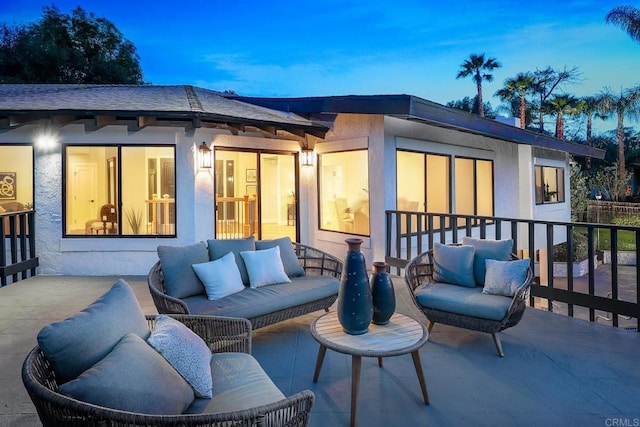 1051 Via Rancho Pkwy, Escondido, CA 92029 - patio terrace at dusk featuring an outdoor living space