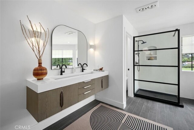5933 Birkdale Ln, San Luis Obispo, CA 93401 - full bathroom with double vanity, plenty of natural light, wood finished floors, and walk in shower