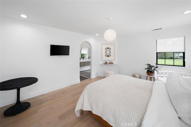 5933 Birkdale Ln, San Luis Obispo, CA 93401 - bedroom with arched walkways, light wood-style flooring, recessed lighting, and baseboards