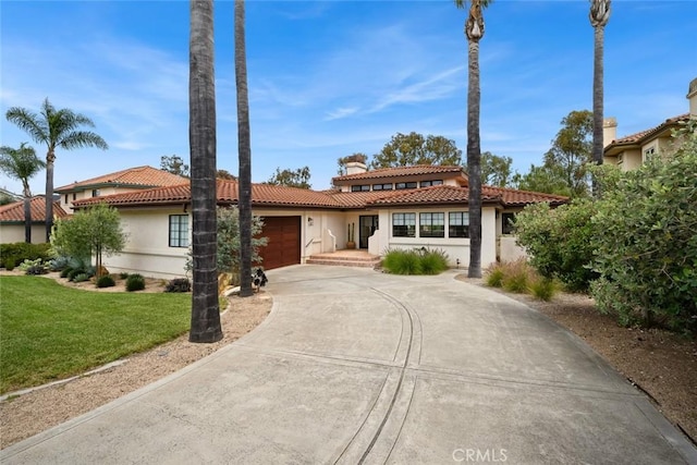5933 Birkdale Ln, San Luis Obispo, CA 93401 - mediterranean / spanish home with a tile roof, a garage, stucco siding, concrete driveway, and a front yard