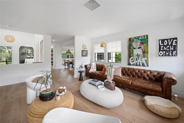 5933 Birkdale Ln, San Luis Obispo, CA 93401 - living area featuring plenty of natural light, wood finished floors, and arched walkways