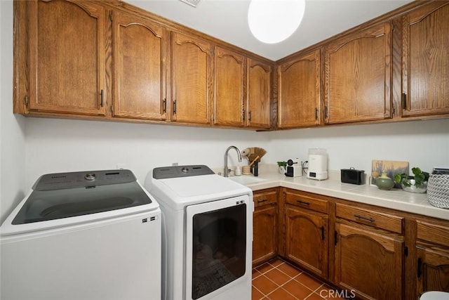 5933 Birkdale Ln, San Luis Obispo, CA 93401 - laundry room with independent washer and dryer, dark tile patterned flooring, and cabinet space