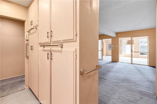 332 E 7th St, San Jacinto, CA 92583 - hall featuring light colored carpet and a textured ceiling