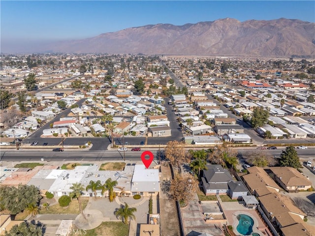 332 E 7th St, San Jacinto, CA 92583 - aerial view of property and surrounding area with nearby suburban area and a mountain backdrop
