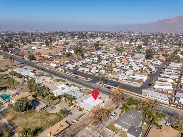 332 E 7th St, San Jacinto, CA 92583 - aerial overview of property's location featuring a mountain backdrop and nearby suburban area