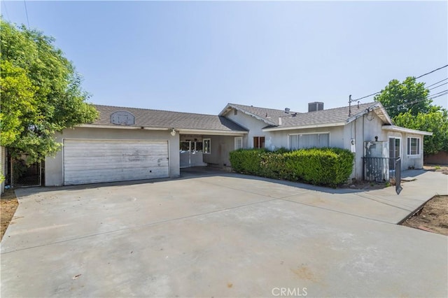 15903 Bryant St, North Hills, CA 91343 - single story home featuring concrete driveway, a garage, stucco siding, and central air condition unit