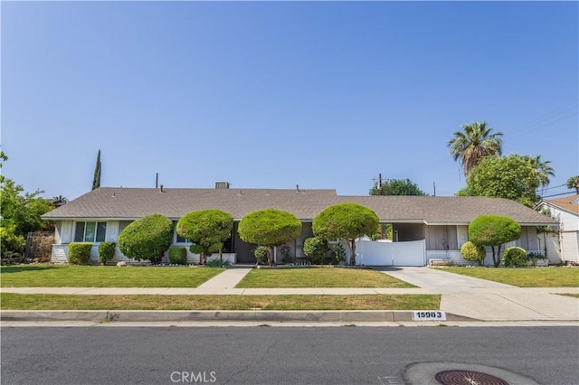 15903 Bryant St, North Hills, CA 91343 - ranch-style house with a front lawn and driveway