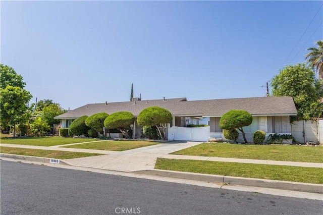 15903 Bryant St, North Hills, CA 91343 - view of front of home with concrete driveway and a front yard