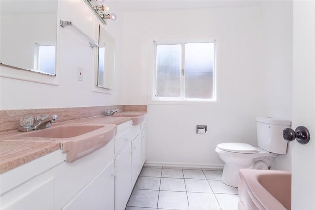 15903 Bryant St, North Hills, CA 91343 - bathroom featuring double vanity, toilet, a bathtub, and tile patterned flooring