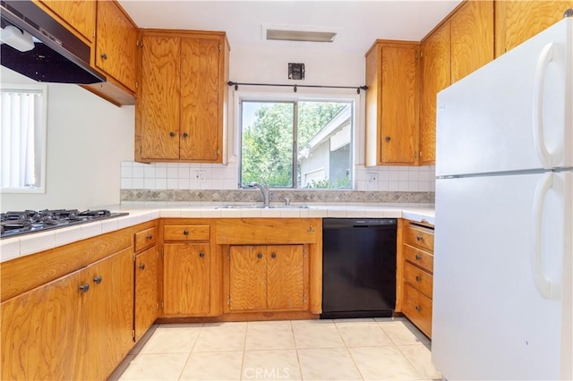 15903 Bryant St, North Hills, CA 91343 - kitchen featuring black appliances, a sink, under cabinet range hood, backsplash, and brown cabinets