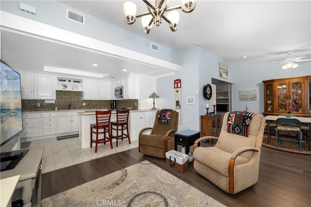 1420 Northwood Rd Unit 241C, Seal Beach, CA 90740 - living area with a chandelier, ceiling fan, and recessed lighting
