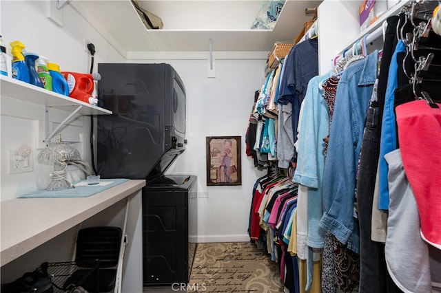 1420 Northwood Rd Unit 241C, Seal Beach, CA 90740 - laundry area featuring stacked washing machine and dryer and baseboards